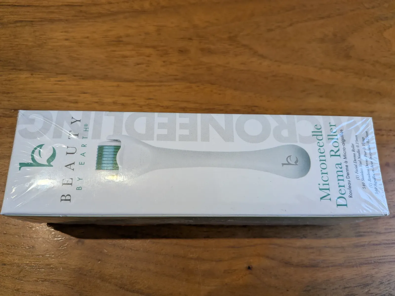 Sealed retail packaging of a Beauty by Earth derma roller — typical of the consumer-grade products sold for facial use, marked as 0.25 mm needle length